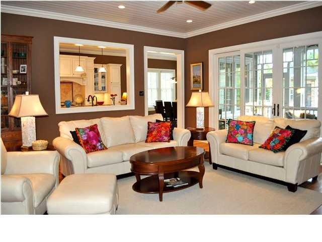 Comfortable Living Room Kitchen Inspirational A fortable Living Room Kept Spacious with A Peek A Boo Kitchen Window and Deck Doors