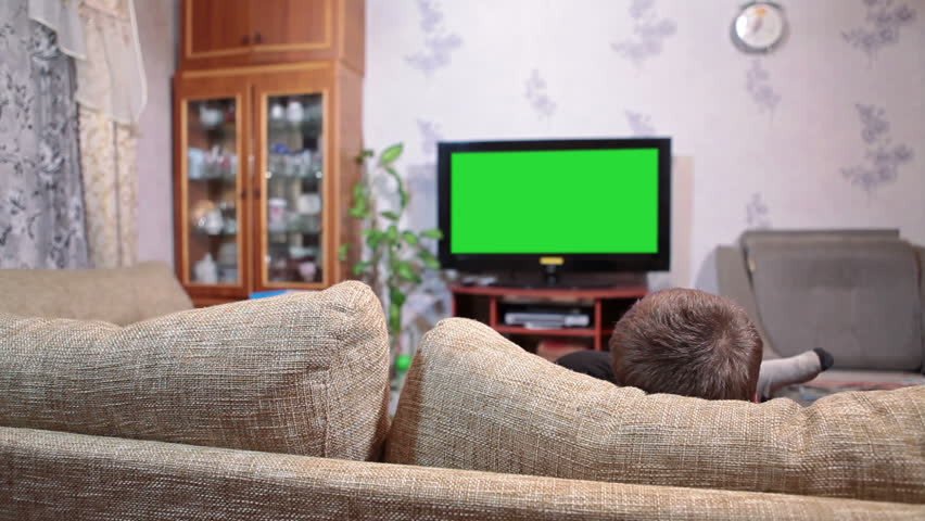 Comfortable Living Roomfor Movie Watching Fresh Young Boy Sitting sofa and Watching Green Screen Tv In Living Room Stock Footage Video