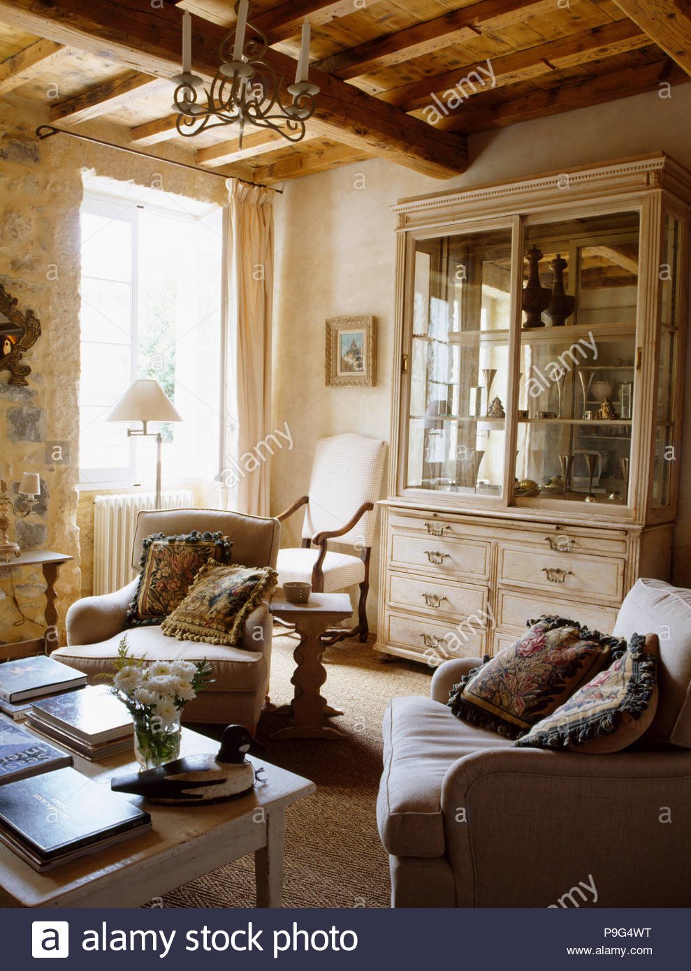 Comfortable Rustic Living Room Lovely fortable Armchairs In French Country Living Room with Glass Fronted Dresser and Rustic Beamed